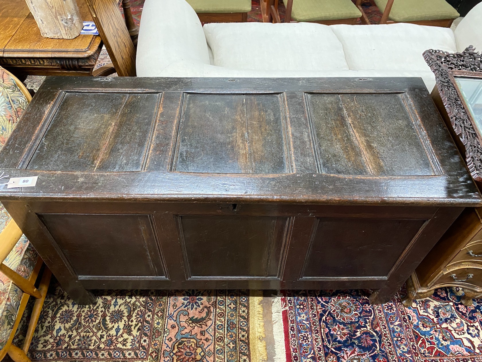 An early 18th century panelled oak coffer, length 136cm, depth 56cm, height 73cm